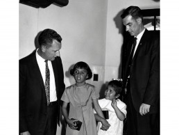Photo of Little & Kiwanis member presenting students with Hearing Aids