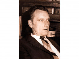 Photo of Little in his office