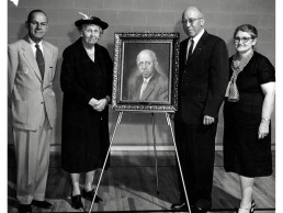 Photo of Board of Regent's President Alberta Schmidt presenting painting to Dr. Hester