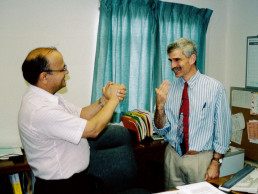 Photo of Dr. Vasishta congratulating Dr. Stern, NMSD's 8th Superintendent - August 2001