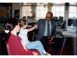 Photo of Dr. Vasishta meeting Elementary Students - 1995