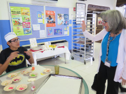 Photo of Dr. Gallegos & Waylon Lopez during the cookie community service project for Kitchen Angels