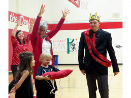 Photo of Dr. Gallegos crowning Homecoming Prince