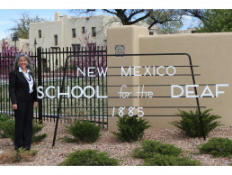 Photo of Dr. Gallegos at NMSD's front gate